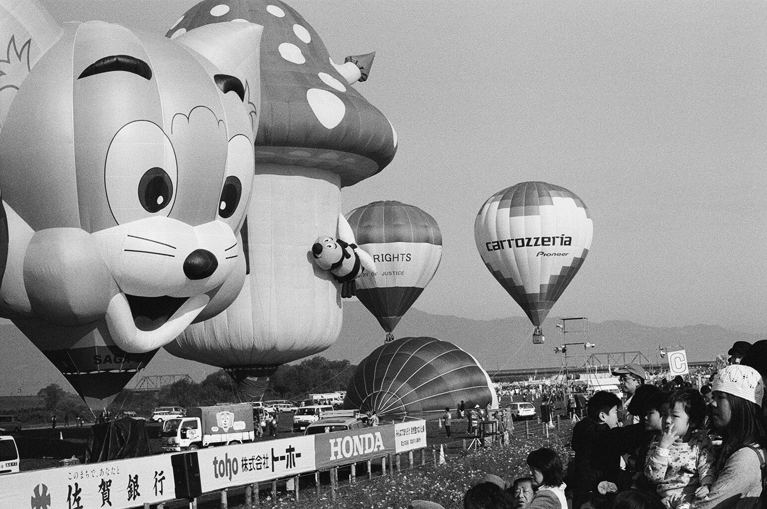 Black and white photograph of hot-air balloons